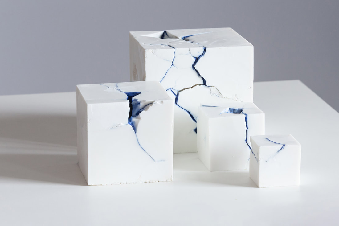 Fragmented solid parian porcelain with fragmented cavity and blue porcelain detail. Anne Butler ceramics